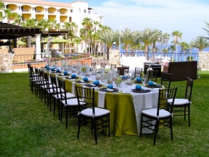 green and off white linens set-up for wedding at the Hilton Los Cabos